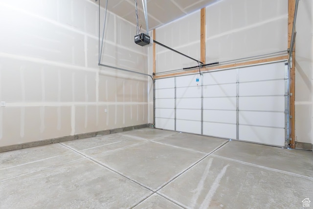 684 S 3550 W Unit 131, West Weber, UT 84401 - garage featuring a garage door opener and baseboards
