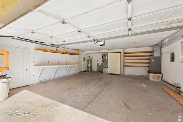 garage with a garage door opener, heating unit, electric panel, and water heater