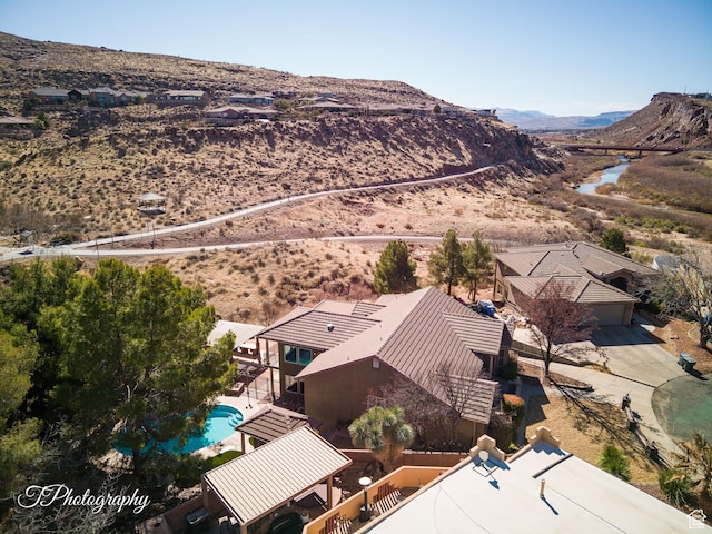birds eye view of property with a mountain view