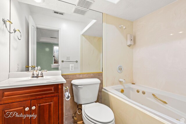 full bathroom featuring vanity, tile walls, toilet, and shower / bathing tub combination