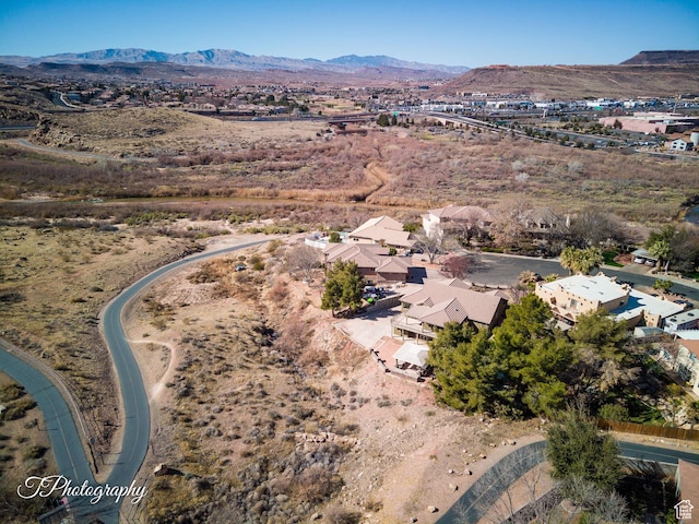 drone / aerial view featuring a mountain view
