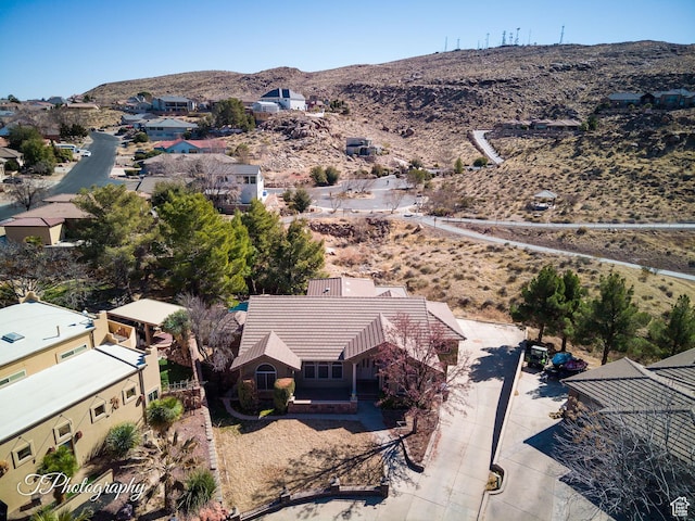 birds eye view of property with a mountain view