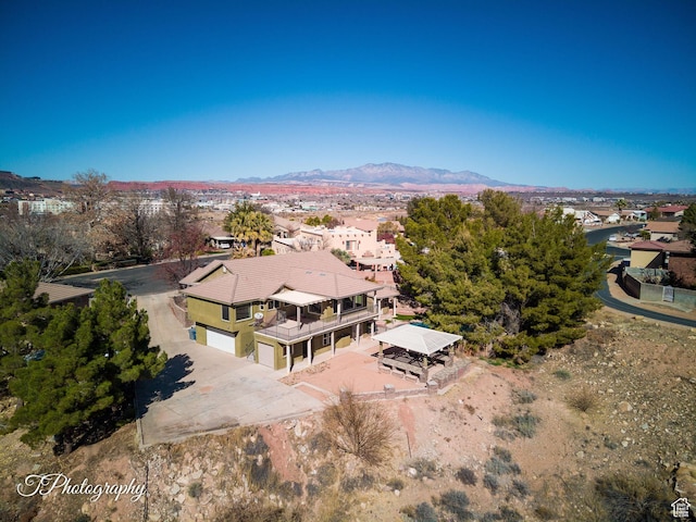 drone / aerial view featuring a mountain view