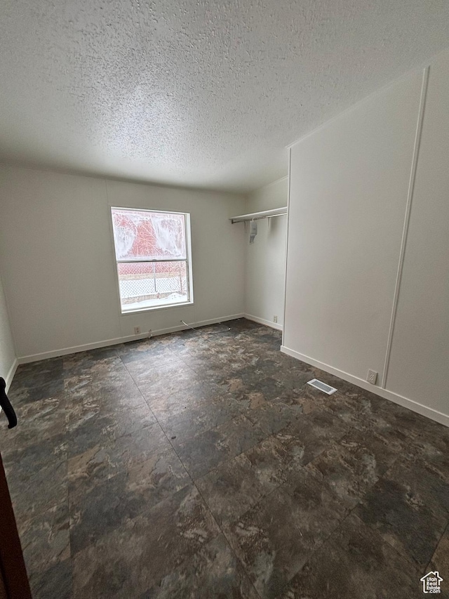 260 S 300 E, Heber City, UT 84032 - spare room featuring visible vents, baseboards, and a textured ceiling