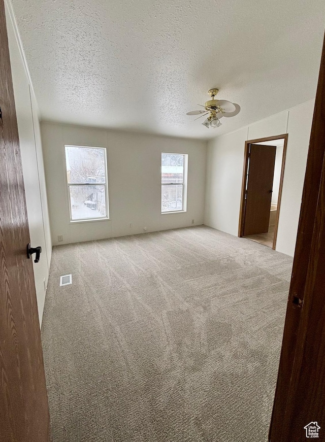 260 S 300 E, Heber City, UT 84032 - empty room featuring a textured ceiling, visible vents, ceiling fan, and carpet