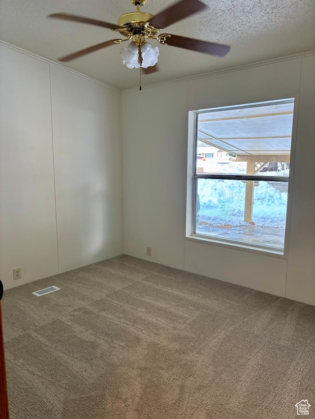 260 S 300 E, Heber City, UT 84032 - empty room featuring ceiling fan, a textured ceiling, ornamental molding, visible vents, and carpet flooring