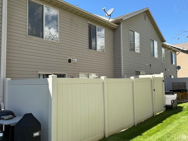 2044 N Evans Cove Loop W, Layton, UT 84041 - view of side of home featuring fence and a yard