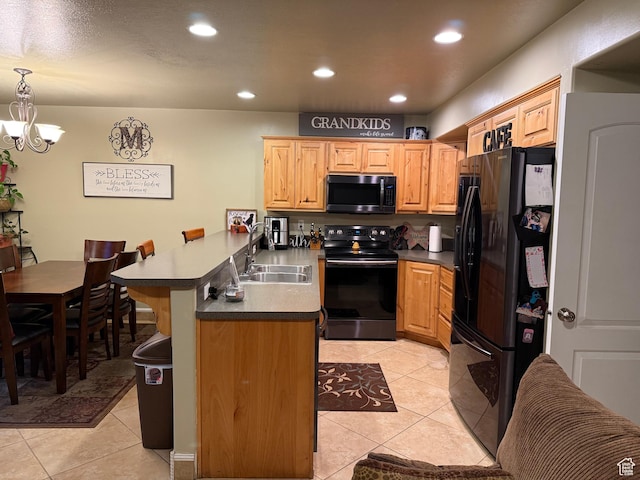2044 N Evans Cove Loop W, Layton, UT 84041 - kitchen featuring a peninsula, a kitchen bar, recessed lighting, a sink, and black appliances