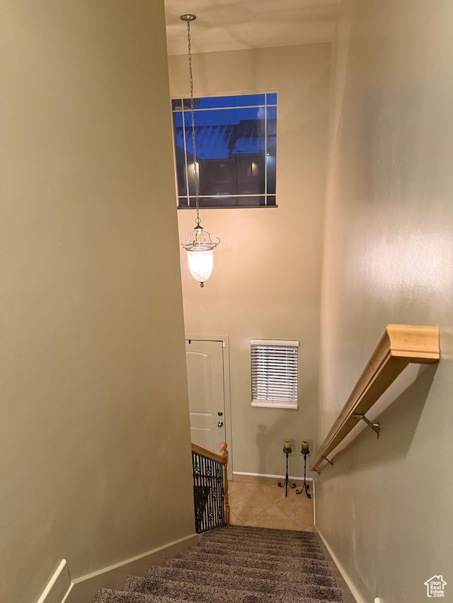 2044 N Evans Cove Loop W, Layton, UT 84041 - stairs featuring baseboards and tile patterned flooring
