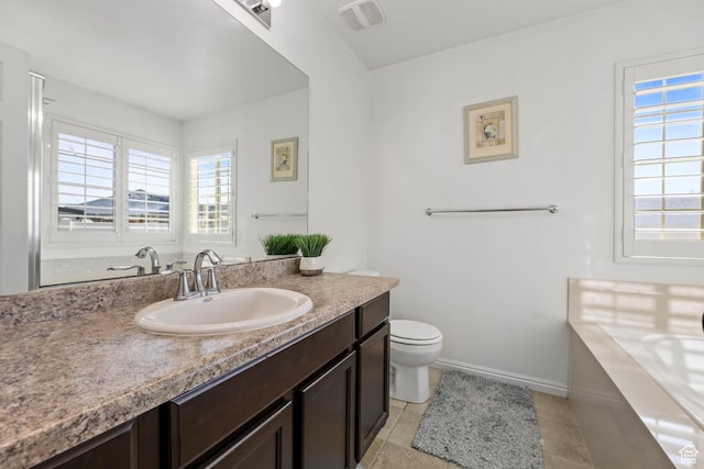 5171 W Dartford Way, West Valley City, UT 84120 - bathroom with tile patterned floors, vanity, toilet, and a wealth of natural light
