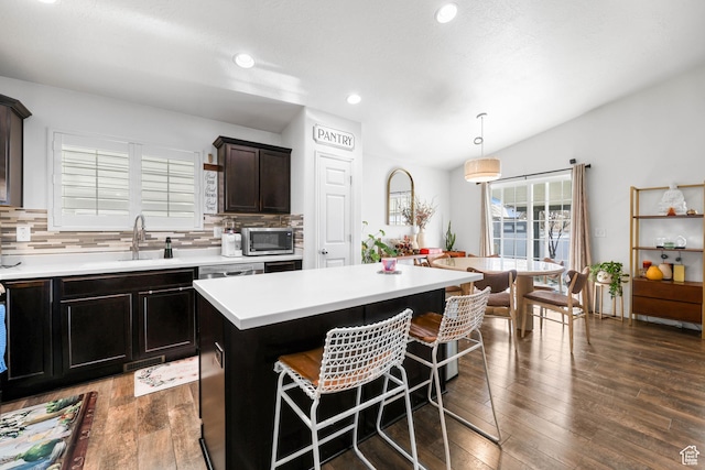 5171 W Dartford Way, West Valley City, UT 84120 - kitchen featuring a center island, decorative backsplash, dark hardwood / wood-style floors, and decorative light fixtures