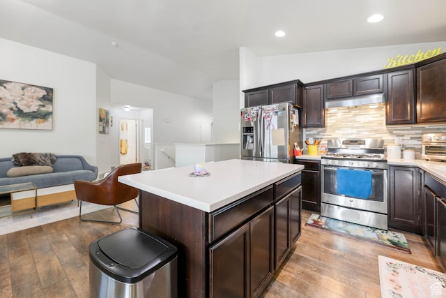 5171 W Dartford Way, West Valley City, UT 84120 - kitchen featuring appliances with stainless steel finishes, a center island, lofted ceiling, and dark brown cabinets