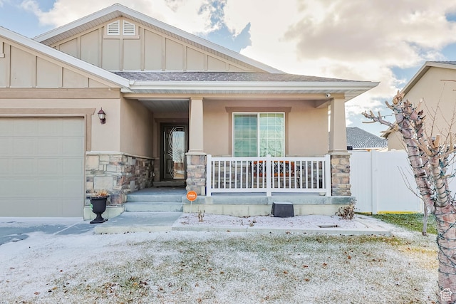 5171 W Dartford Way, West Valley City, UT 84120 - view of front of home featuring a garage and a porch