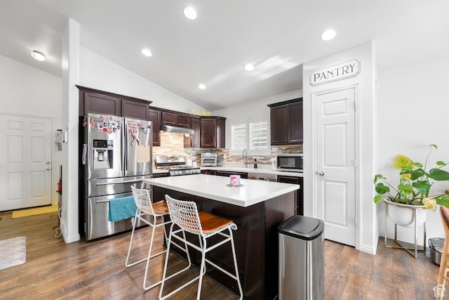 5171 W Dartford Way, West Valley City, UT 84120 - kitchen featuring lofted ceiling, appliances with stainless steel finishes, backsplash, dark brown cabinetry, and a kitchen island