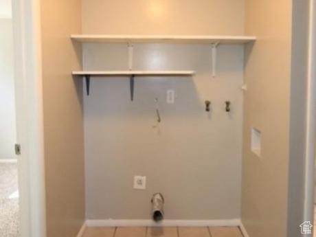 4548 W 4695 S, West Valley City, UT 84120 - laundry room featuring laundry area, tile patterned flooring, hookup for a washing machine, and baseboards