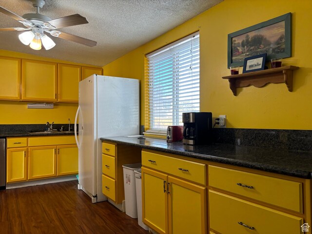 4548 W 4695 S, West Valley City, UT 84120 - kitchen featuring a textured ceiling, dark wood-style flooring, a sink, a ceiling fan, and freestanding refrigerator