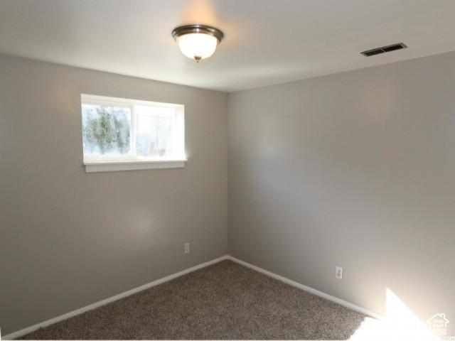 4548 W 4695 S, West Valley City, UT 84120 - carpeted spare room featuring visible vents and baseboards