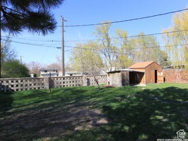 4548 W 4695 S, West Valley City, UT 84120 - view of yard featuring fence and an outdoor structure