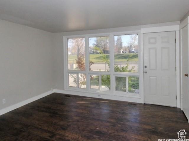 4548 W 4695 S, West Valley City, UT 84120 - interior space featuring a healthy amount of sunlight, baseboards, and wood finished floors