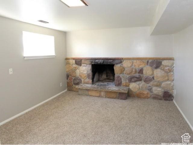 4548 W 4695 S, West Valley City, UT 84120 - carpeted living room with visible vents, a fireplace, and baseboards