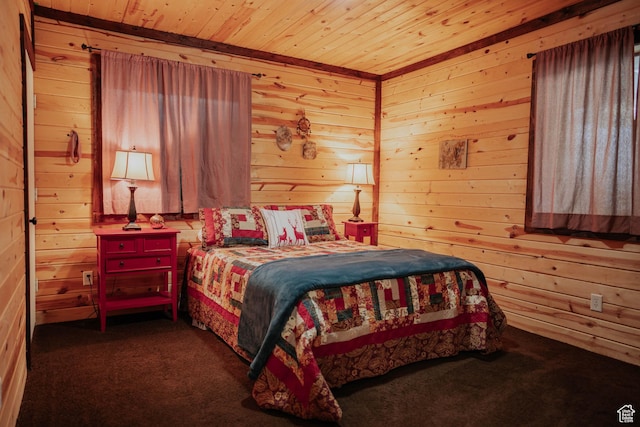 bedroom featuring wooden ceiling, wooden walls, and carpet floors