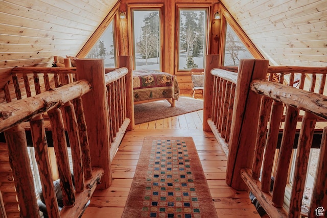 additional living space with wood ceiling, light wood finished floors, and lofted ceiling
