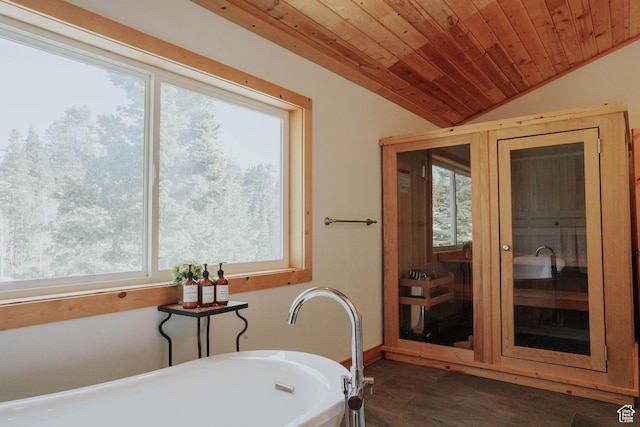 bathroom with wood finished floors, a soaking tub, vaulted ceiling, and wood ceiling