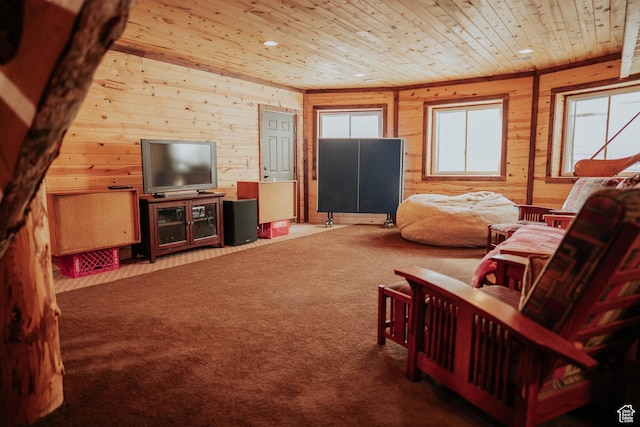carpeted living room featuring wood ceiling and wooden walls