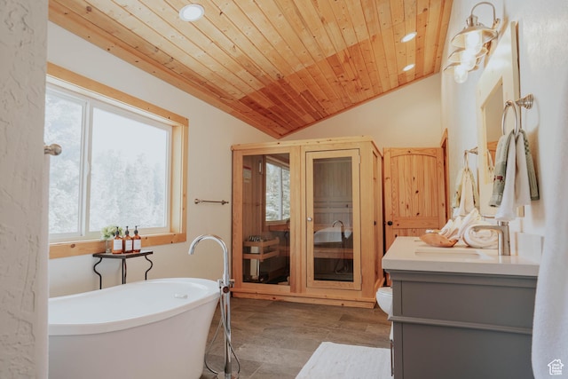 full bathroom featuring wood finished floors, recessed lighting, vaulted ceiling, and a soaking tub