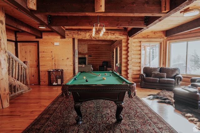 playroom with log walls, beamed ceiling, pool table, and wood finished floors