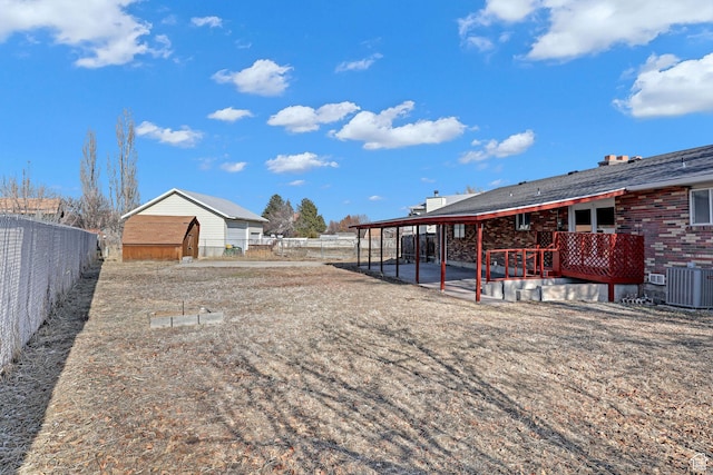 view of yard featuring central AC and a patio area