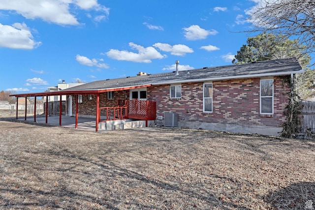 back of house featuring central AC unit and a patio
