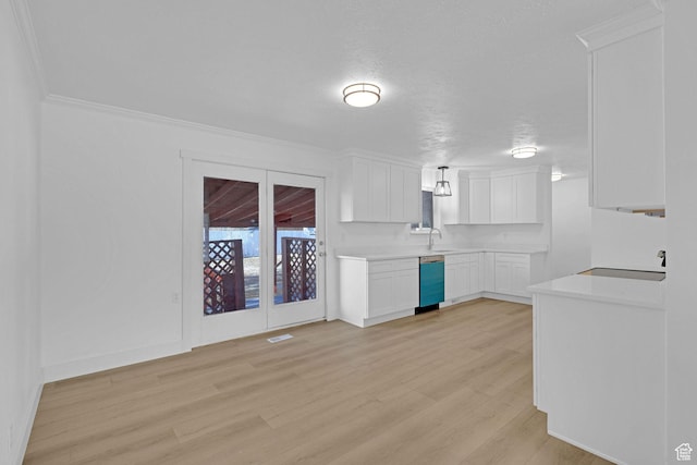 kitchen with dishwasher, sink, white cabinets, and light hardwood / wood-style flooring