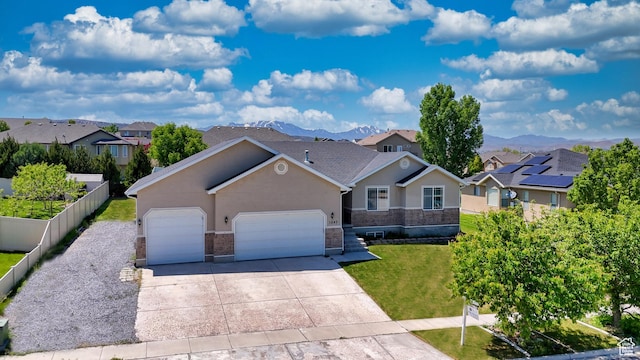 1247 S Alpine Dr, Saratoga Springs, UT 84045 - ranch-style house with stucco siding, a residential view, an attached garage, and driveway