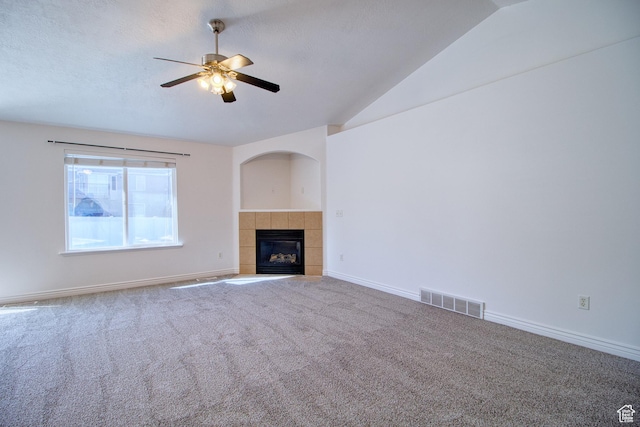 1247 S Alpine Dr, Saratoga Springs, UT 84045 - unfurnished living room with ceiling fan, carpet, a tile fireplace, baseboards, and vaulted ceiling