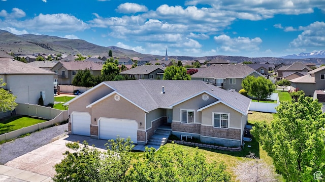 1247 S Alpine Dr, Saratoga Springs, UT 84045 - view of front of house with stone siding, stucco siding, a residential view, and an attached garage