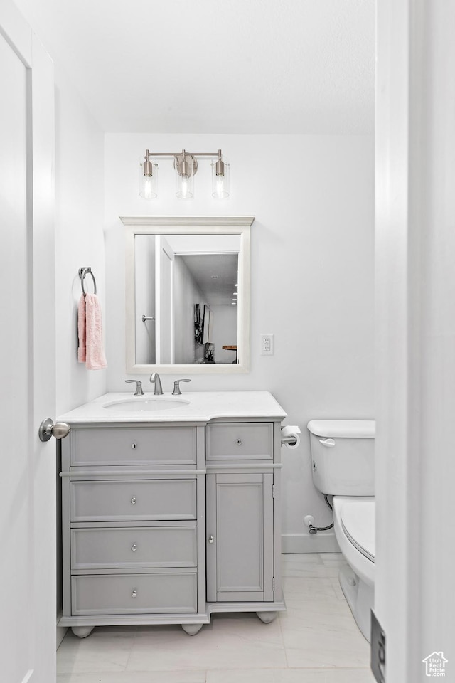 11283 S Willow Walk Dr W, South Jordan, UT 84009 - half bathroom with toilet, vanity, and baseboards