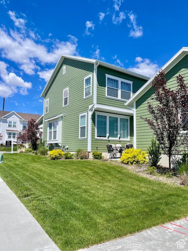 11283 S Willow Walk Dr W, South Jordan, UT 84009 - view of home's exterior featuring a yard