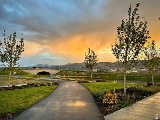 11283 S Willow Walk Dr W, South Jordan, UT 84009 - view of home's community featuring a water and mountain view and a lawn