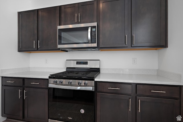 621 W 950 S, Springville, UT 84663 - kitchen with dark brown cabinets, appliances with stainless steel finishes, and light countertops