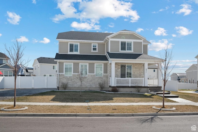 621 W 950 S, Springville, UT 84663 - view of front of home featuring stone siding, covered porch, a shingled roof, and fence