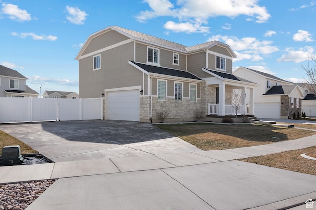 621 W 950 S, Springville, UT 84663 - view of front of house with a gate, stone siding, fence, concrete driveway, and an attached garage