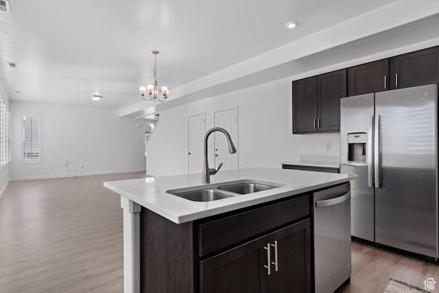 621 W 950 S, Springville, UT 84663 - kitchen with a sink, light wood-style floors, appliances with stainless steel finishes, light countertops, and dark brown cabinets
