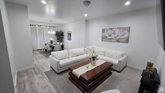 5343 W Big Sur Dr, South Jordan, UT 84009 - living room featuring baseboards, light wood finished floors, a chandelier, and recessed lighting