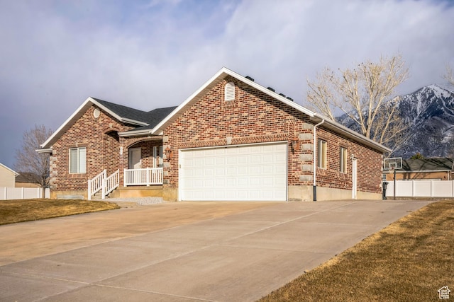 877 S 200 W, Mona, UT 84645 - view of front of house featuring a garage and a mountain view