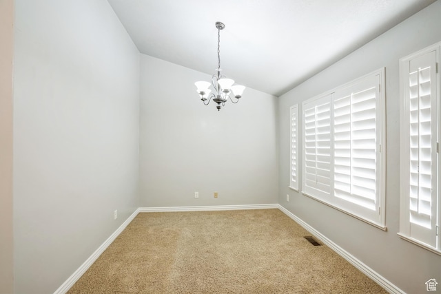877 S 200 W, Mona, UT 84645 - carpeted spare room with lofted ceiling and a notable chandelier