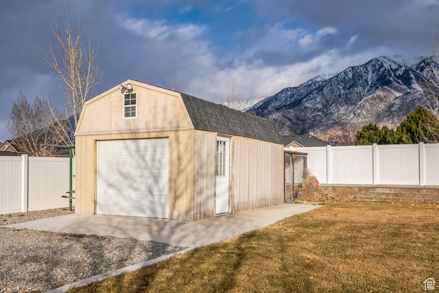 877 S 200 W, Mona, UT 84645 - garage featuring a mountain view and a yard