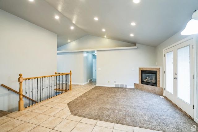 877 S 200 W, Mona, UT 84645 - interior space with a tiled fireplace, lofted ceiling, light colored carpet, and french doors