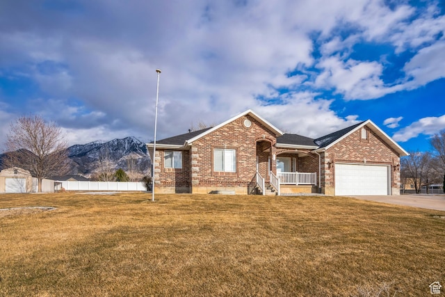 877 S 200 W, Mona, UT 84645 - single story home featuring a garage, a mountain view, a porch, and a front lawn