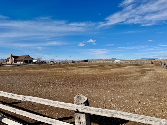 view of yard with fence and a mountain view